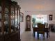 Dining room with china cabinet, grand father clock and chandelier at 11552 Sw 138Th Ln, Dunnellon, FL 34432