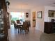 Dining area with an elegant chandelier, table, and chairs set on tile floors at 11552 Sw 138Th Ln, Dunnellon, FL 34432