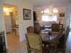 Dining room view towards kitchen and Gathering room at 11552 Sw 138Th Ln, Dunnellon, FL 34432