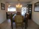 Dining room featuring a decorative table with a chandelier overhead at 11552 Sw 138Th Ln, Dunnellon, FL 34432