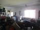 Cluttered garage storing furniture and other miscellaneous items at 11552 Sw 138Th Ln, Dunnellon, FL 34432