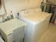 Laundry room featuring a sink, washer, and dryer for convenient chores at 11552 Sw 138Th Ln, Dunnellon, FL 34432