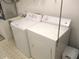 Well-equipped laundry area includes a washer, dryer, and utility sink for added convenience at 11552 Sw 138Th Ln, Dunnellon, FL 34432
