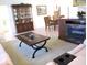 Open living room concept showing fireplace and dining table at 11552 Sw 138Th Ln, Dunnellon, FL 34432