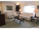 Spacious living room featuring a ceiling fan and comfortable seating at 11552 Sw 138Th Ln, Dunnellon, FL 34432