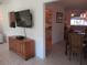 Living room with open access to kitchen and dining room boasts large television and stylish decor at 11552 Sw 138Th Ln, Dunnellon, FL 34432