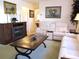 Charming living room with fireplace, with view of the sofas and decorated wall at 11552 Sw 138Th Ln, Dunnellon, FL 34432