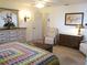 Spacious main bedroom features a large dresser, stylish decor, and access to the ensuite bathroom at 11552 Sw 138Th Ln, Dunnellon, FL 34432