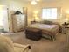 Bright main bedroom offers ample space, a dresser, and a colorful quilted bedspread at 11552 Sw 138Th Ln, Dunnellon, FL 34432
