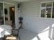Outdoor space featuring a covered patio with fan and table, perfect for entertaining at 11552 Sw 138Th Ln, Dunnellon, FL 34432