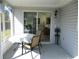 Covered patio with table and chairs, and fan, provides a relaxing outdoor living space at 11552 Sw 138Th Ln, Dunnellon, FL 34432