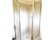 Corner shower stall with textured glass door and silver trim, features tiled walls at 11552 Sw 138Th Ln, Dunnellon, FL 34432
