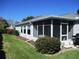 Enclosed sunroom providing a bright and airy space to relax and enjoy the outdoors at 11552 Sw 138Th Ln, Dunnellon, FL 34432