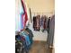 Spacious walk-in closet with ample storage and hanging racks for organized wardrobe at 11552 Sw 138Th Ln, Dunnellon, FL 34432