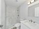 Bathroom featuring a stand-up shower with modern marble style tile and glass shelving at 13272 Sw 112Th Pl, Dunnellon, FL 34432