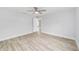A bright bedroom with neutral walls, a ceiling fan, and wood-look flooring at 13292 Sw 112Th Pl, Dunnellon, FL 34432