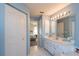 En-suite bathroom with walk-in closet access and a spacious vanity at 13677 Sw 40Th Avenue Rd, Ocala, FL 34473