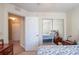 Bedroom view with access to the hallway and large closet with mirrored doors at 13677 Sw 40Th Avenue Rd, Ocala, FL 34473