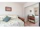 Cozy bedroom features daybed with patterned linens, decorative pillows, and mirrored closet doors at 13677 Sw 40Th Avenue Rd, Ocala, FL 34473