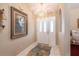 Inviting entryway features tiled floor, neutral walls, chandelier lighting, and arched doorway at 13677 Sw 40Th Avenue Rd, Ocala, FL 34473