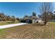 View of house with an oversized driveway at 13677 Sw 40Th Avenue Rd, Ocala, FL 34473