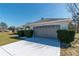 Well-maintained exterior with large garage and manicured shrubs at 13677 Sw 40Th Avenue Rd, Ocala, FL 34473