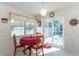 Charming breakfast nook bathed in natural light, offering serene views of the pool area and backyard at 13677 Sw 40Th Avenue Rd, Ocala, FL 34473