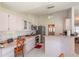 Bright kitchen with a breakfast bar, stainless steel appliances, and stylish tile flooring at 13677 Sw 40Th Avenue Rd, Ocala, FL 34473