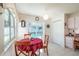 Bright breakfast nook features a round table, natural light, and views of the refreshing pool area at 13677 Sw 40Th Avenue Rd, Ocala, FL 34473