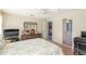 The main bedroom has a spacious layout with access to a large mirror, living room and bathroom at 13677 Sw 40Th Avenue Rd, Ocala, FL 34473