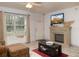 Inviting living room with a fireplace, tile floors, and natural light at 1509 Ne 30Th St, Ocala, FL 34479