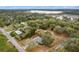 Aerial view showing the property and its proximity to the nearby lake at 16320 Se 16Th Pl, Ocklawaha, FL 32179