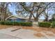 Exterior view of the home featuring unique architecture and landscaping at 16320 Se 16Th Pl, Ocklawaha, FL 32179