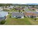 Aerial view of a home showcasing its backyard, landscaping, and neighborhood at 17799 Se 125Th Cir, Summerfield, FL 34491
