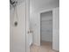 Bathroom with white tiled shower stall and doorway to the walk-in closet at 17799 Se 125Th Cir, Summerfield, FL 34491