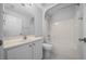 Clean bathroom with a white vanity, toilet, and shower-tub combo at 17799 Se 125Th Cir, Summerfield, FL 34491