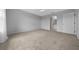 Bright bedroom with neutral carpet, ceiling fan, and view to an adjoining bathroom at 17799 Se 125Th Cir, Summerfield, FL 34491
