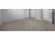 Spacious bedroom featuring neutral carpet and a built-in closet for ample storage at 17799 Se 125Th Cir, Summerfield, FL 34491