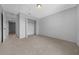 Bright bedroom featuring neutral carpet, overhead light and double door closet at 17799 Se 125Th Cir, Summerfield, FL 34491