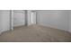 Bedroom with neutral carpet and a standard sized closet with bi-fold doors at 17799 Se 125Th Cir, Summerfield, FL 34491