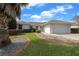 Charming single-story home with manicured lawn, landscaped flower beds, and a two-car garage at 17799 Se 125Th Cir, Summerfield, FL 34491