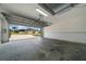 Spacious two-car garage with ample room for vehicles and storage, featuring a large garage door at 17799 Se 125Th Cir, Summerfield, FL 34491