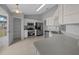 Bright kitchen featuring stainless appliances, ample counter space, and tile flooring at 17799 Se 125Th Cir, Summerfield, FL 34491