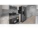 Modern kitchen featuring stainless steel appliances, ample cabinet space and tile flooring at 17799 Se 125Th Cir, Summerfield, FL 34491
