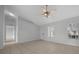 Living area with neutral paint, tile floors, ceiling fan, and windows with blinds at 17799 Se 125Th Cir, Summerfield, FL 34491