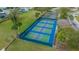 Overhead view of community pickleball courts with lush landscaping and parking nearby at 17799 Se 125Th Cir, Summerfield, FL 34491