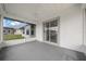 Screened-in porch with ceiling fan perfect for enjoying the outdoors comfortably at 17799 Se 125Th Cir, Summerfield, FL 34491