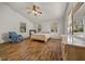 Bright bedroom features wood floors, natural light from three windows, and ample closet space at 18434 Se 24Th St, Silver Springs, FL 34488