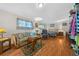Cozy living space with laminate floors, sofa, and natural light at 18434 Se 24Th St, Silver Springs, FL 34488