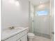 Modern bathroom with a sleek glass-enclosed shower, contemporary vanity, and elegant finishes at 1929 Nw 85Th Loop, Ocala, FL 34475